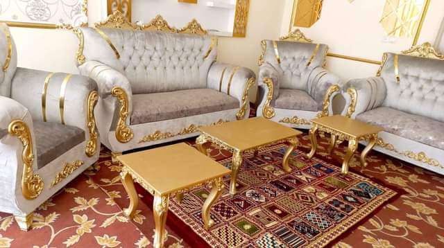Seven seater sofa with three tables.